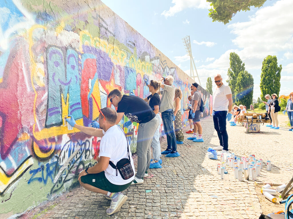 Professional graffiti equipment and preparation for a large-scale team building event in Berlin.